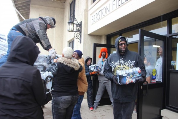 County Commissioner Bryant Nolden distributes water in Flint with neighborhood volunteers.
