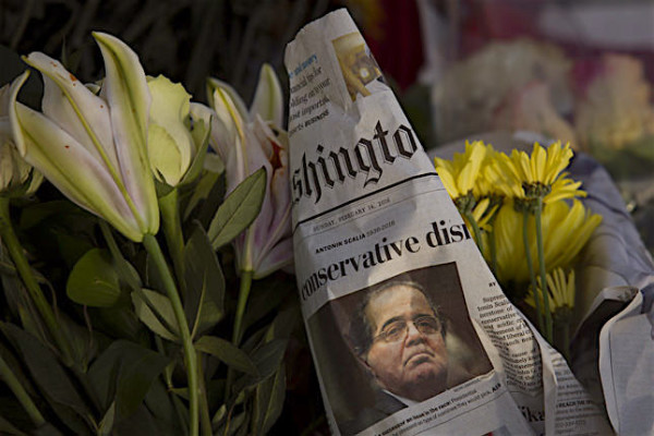  A makeshift memorial for Supreme Court Justice Antonin Scalia is seen at the U.S. Supreme Court, February 14, 2016 in Washington, DC. Supreme Court Justice Antonin Scalia was at a Texas Ranch Saturday morning when he died at the age of 79.
