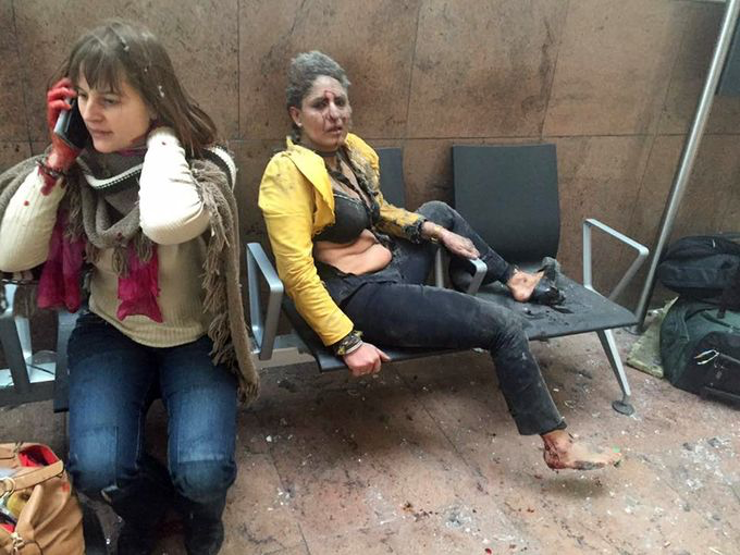 photo: Ketevan Kardava—Georgian Public Broadcaster/AP; Caption: In this photo provided by Georgian Public Broadcaster and photographed by Ketevan Kardava, two women are wounded in Brussels Airport in Belgium after explosions were heard on March 22, 2016.