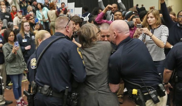 Christopher Morris in the hands of security at Trump rally in Virginia.