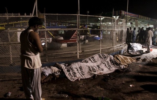 Bodies were lined up by the side of a fairground ride after the tragic bombing in which 65 people have been killed, and the death toll is expected to rise further