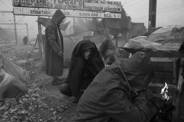 Refugees in camp at border of Greece and Macedonia near town of Idomeni. The refugees are being stopped from moving beyond Greece and have been languishing in the rain and the mud and the cold with insufficient food and medical care while sleeping in small tents. by James Nachtwey