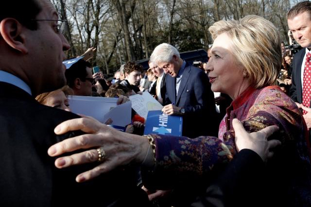 Hillary Clinton greets supporters after voting in the New York presidential primary election at the Grafflin School in Chappaqua, New York, April 19, 2016. REUTERS/Mike Segar