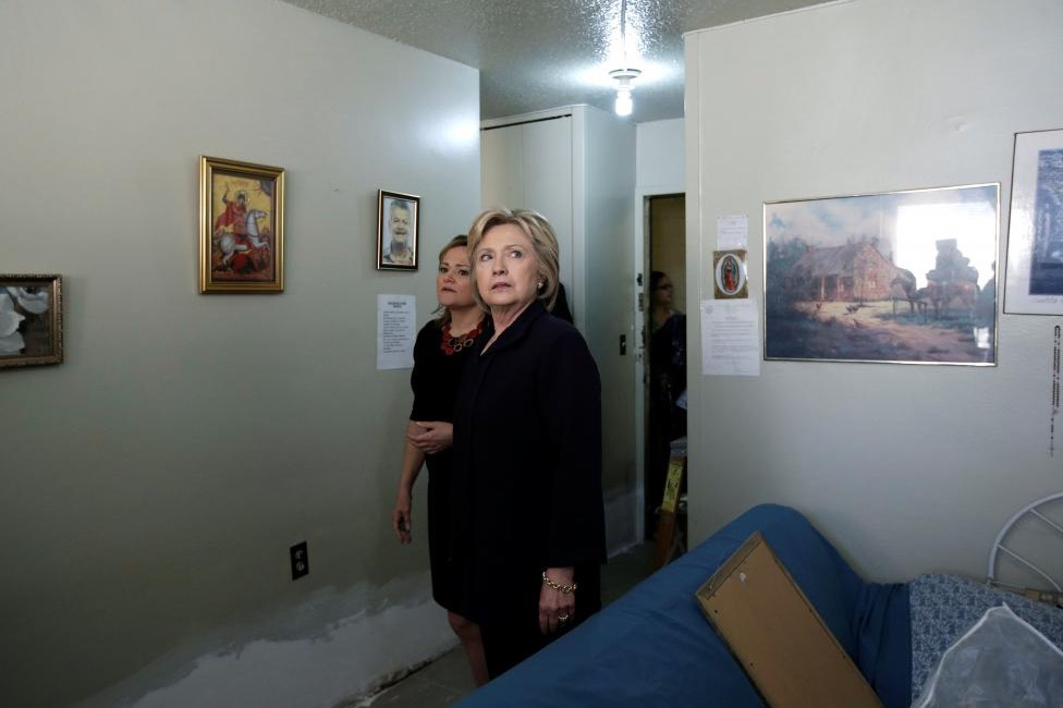 Hillary Clinton and New York City Council Speaker Melissa Mark-Viverito tour an apartment to view conditions at the Corsi House public housing development in Harlem. REUTERS/Mike Segar