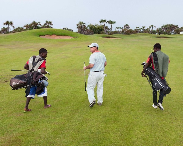 One hour south of Luanda lies the 18-hole Mangais championship golf course, host to PGA tournaments. Mercer, a leading financial analysis firm, ranks Luanda as the most expensive city in the world. This is despite the fact that two-thirds of Angola’s population lives on less than $2 a day and 150,000 children die before the age of 5 each year, from causes linked to poverty. Over 98% of Angola’s exports come from oil or diamonds. Researchers James Boyce and Léonce Ndikumana showed that Angola suffered $80 billion in capital flight from 1970-2008, with most of the money ending up in tax havens. Angola. Paolo Woods & Gabriele Galiberti