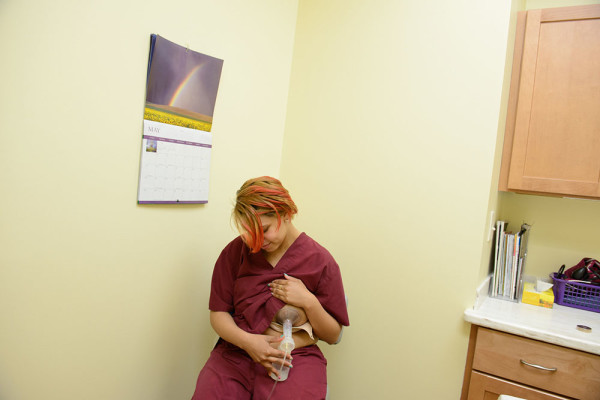 Kayla Jones, a 25-year-old nurse, pumping breast milk for her four-month-old baby at Buffalo Womenservices. She assists with abortion procedures and gave birth at the Birth Center of Buffalo.