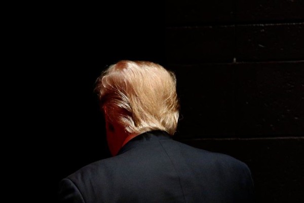 Republican presidential candidate Donald Trump walks off stage after speaking at a campaign event at St. Norbert College in De Pere, Wis., Wednesday, March 30, 2016. (AP Photo/Patrick Semansky)