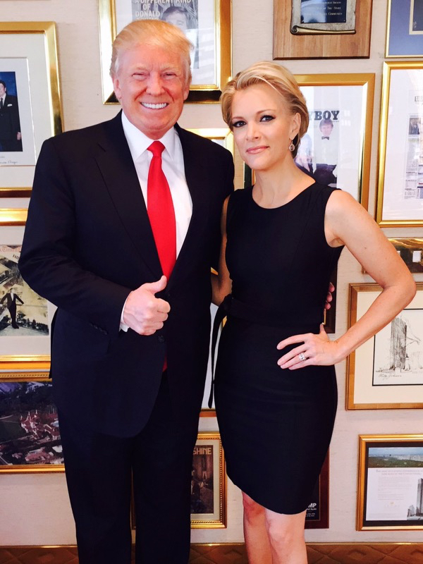 Donald Trump and Megyn Kelly pose in Trump's office in the Trump Tower in front of Trump's framed Playboy cover.