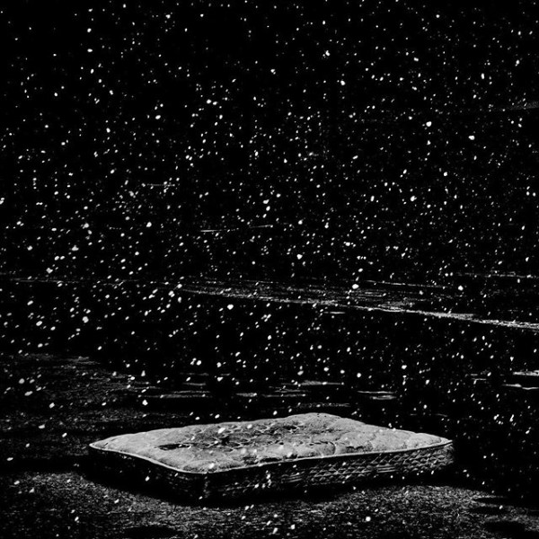 Flint, MI. Snowfall outside a shuttered K-Mart. “We've kinda created our own Hiroshima. Generations from now, we'll still be feeling the effects.”