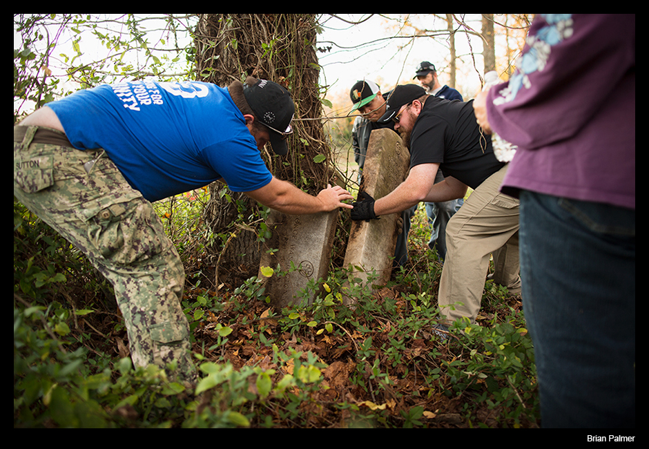 Veterans, wounded warriors, retrieve headstones of fellow servicemen from overgrowth at Evergreen Cemetery in Richmond, VA. November 2015