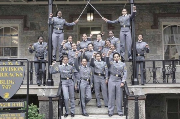 Black female West Point cadets raise their fists in a recent photo.
