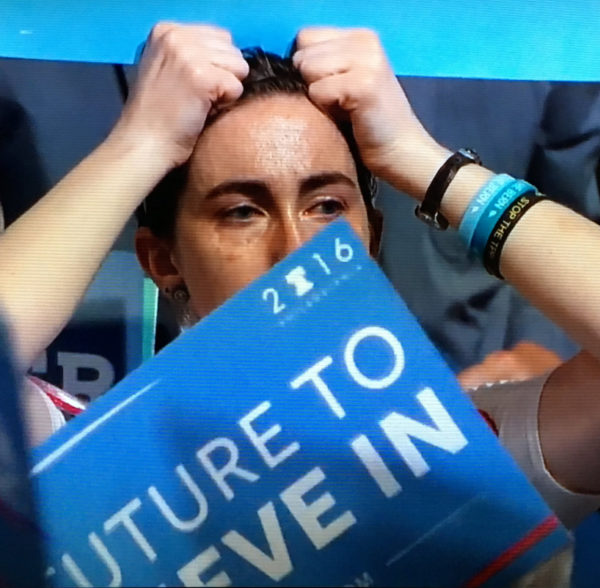 Young people show their emotion during Bernie Sanders's opening night speech at the 2016 Democratic National Convention in Philadelphia. Emotions were running high in the "Democratic family" between followers of Sanders and Hillary Clinton. image: screenshot from DNC YouTube feed.