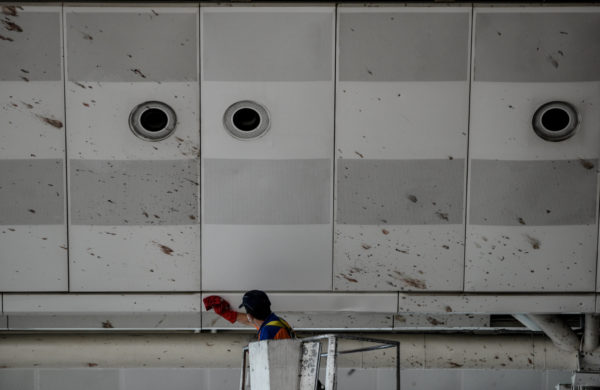 A worker cleaned blood off the ceiling of the international departure terminal at the Istanbul airport on Wednesday. Photo: Gokhan Tan/Getty Images