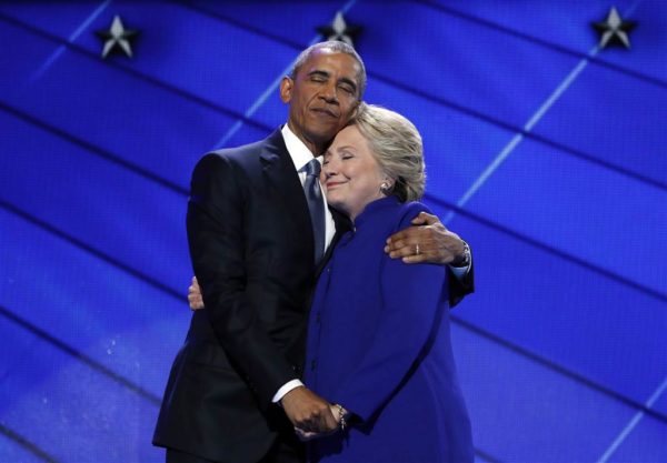 President Obama hugs Hillary Clinton after addressing the delegates at the Democratic Convention in Philadelphia. photo: Carolyn Kaster / AP.
