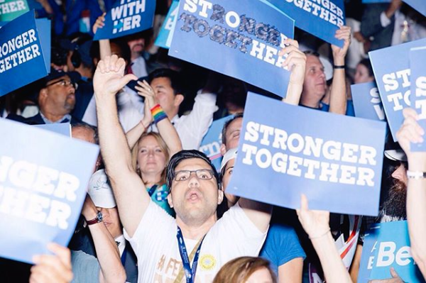 Delegates cheered and booed throughout the night as Hillary Clinton's name was mentioned. Here, a Bernie supporter booed after Sanders announced his support of Clinton. He modified his "Stronger Together" sign to read "Stop Her." Photo by @mscottbrauer for @motherjonesmag