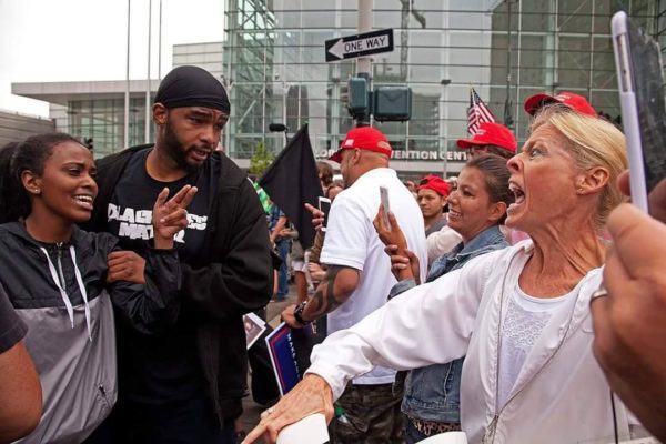 Woman explodes in anger in face off between pro-Trump and anti-Trump protesters at a rally in Denver. Image sourced from social media.