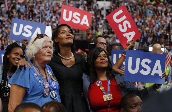 Delegates on the floor of the 2016 Democratic Convention hold up USA signs. REUTERS/Jim Young