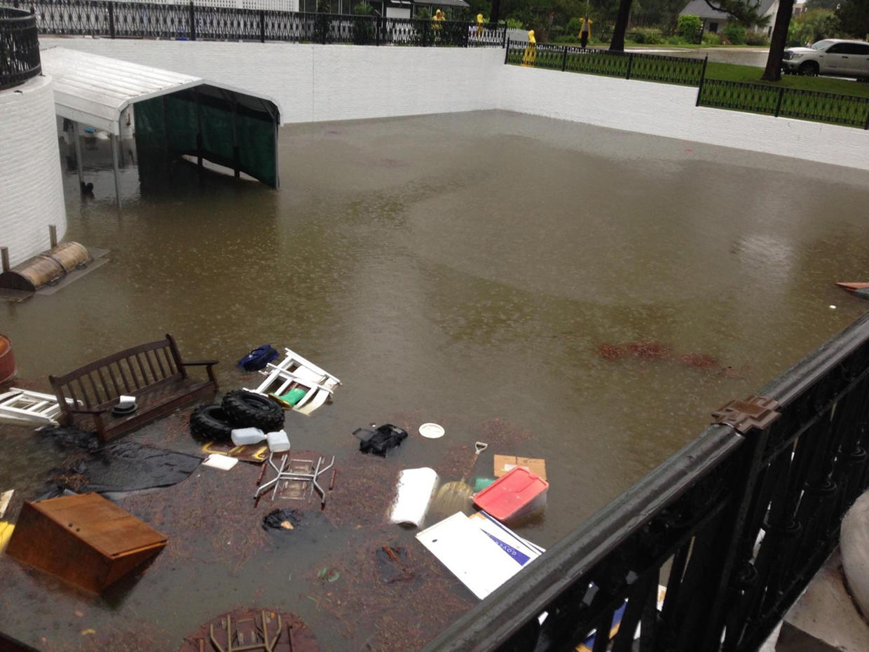 photo: Louisiana Governor's Office. caption: Louisiana Gov. John Bel Edwards declared a state of emergency, calling the floods “historic.” He and his family were even forced to leave the Governor’s Mansion (pictured) when chest-high water filled the basement. He later toured flood-ravaged areas by helicopter and warned Louisiana residents it would be too risky to venture out even once the rains begin to subside.
