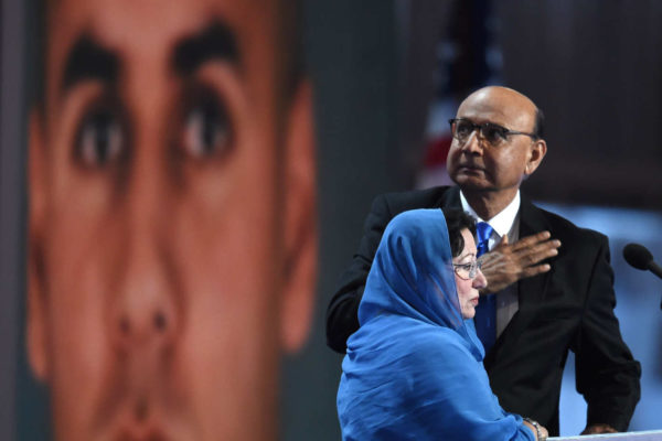 Khizr Khan and his wife Ghazala with an image of their son behind them while addressing the Democratic National Convention in Philadelphia. Photo: Timothy A. Clary/AFP/Getty Images