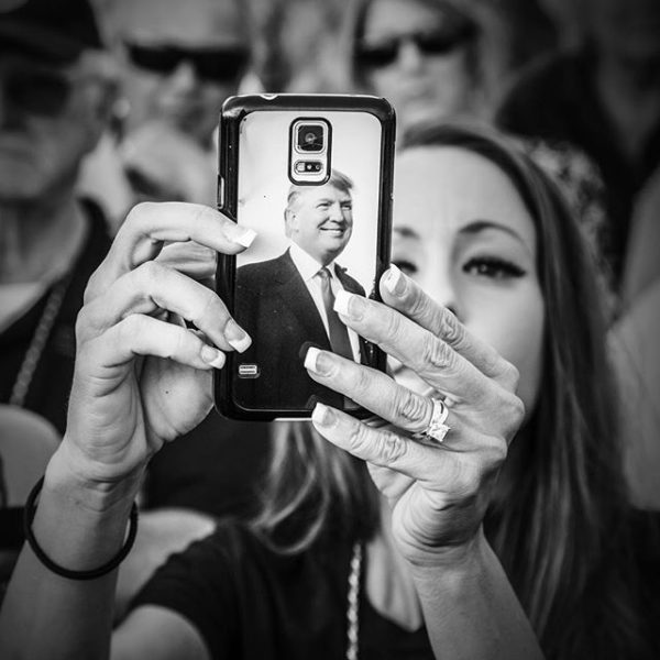 photo: Mark Peterson. A supporter of Donald Trump takes pictures of other supporters aboard the USS Iowa battleship in Los Angeles September 15, 2015 while waiting for @realdonaldtrump to appear. Shot on assignment for @msnbcphoto