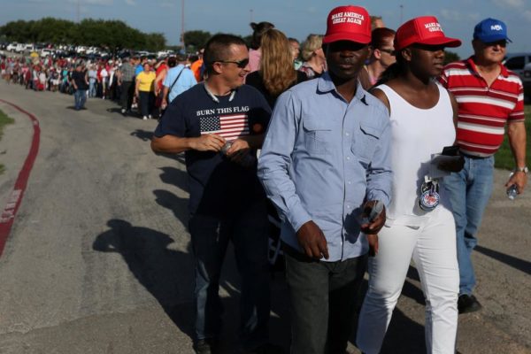 Supporters of Republican presidential nominee Donald Trump line up for a campaign rally in Austin, Texas. REUTERS/Carlo Allegri