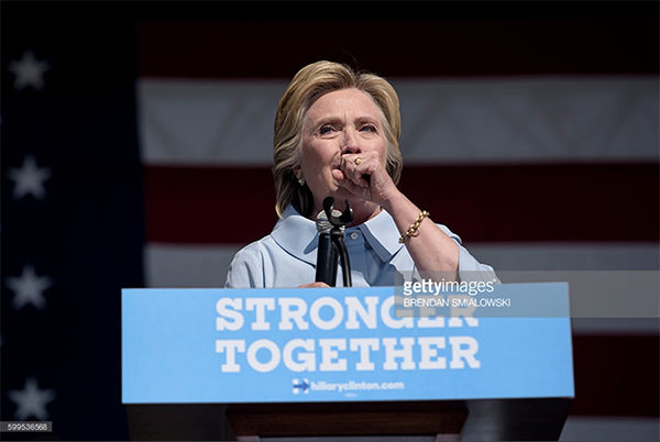 BRENDAN SMIALOWSKI/AFP/Getty Images. Caption: Democratic presidential nominee Hillary Clinton coughs during a Labor Day rally September 5, 2016 in Cleveland, Ohio. Hillary Clinton launched the home stretch of her US presidential bid aiming to solidify her advantages over rival Donald Trump, with both candidates converging on working-class Ohio as ground zero of their 2016 campaign battle.