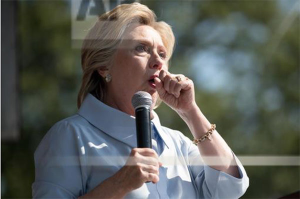Andrew Harnik/AP. caption: Democratic presidential candidate Hillary Clinton stops her speech to cough at the 11th Congressional District Labor Day festival at Luke Easter Park in Cleveland, Ohio, Monday, Sept. 5, 2016.