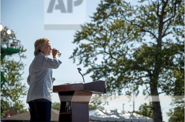 hrc-coughs_4Democratic presidential candidate Hillary Clinton pauses to drink water after coughing as she speaks at the 11th Congressional District Labor Day festival at Luke Easter Park in Cleveland, Ohio, Monday, Sept. 5, 2016. (AP Photo/Andrew Harnik)