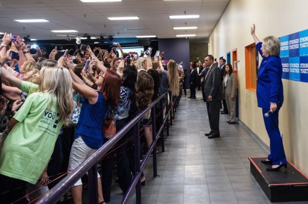 photo: Barbara Kinney/Clinton for America. caption: Young women take selfies with the candidate as Democratic presidential nominee Hillary Clinton speaks to a crowd in an overflow room after a rally at Frontline Outreach and Youth Center September 21, 2016 in Orlando, Florida.