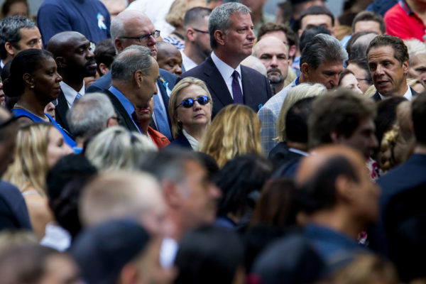 Senator Chuck Schumer, Hillary Clinton, Mayor Bill de Blasio and Gov. Andrew Cuomo at a remembrance ceremony on Sunday in New York City for the 15th anniversary of the Sept. 11, 2001, attacks. Mrs. Clinton left the ceremony early because she was “overheated.” CreditEric Thayer for The New York Times