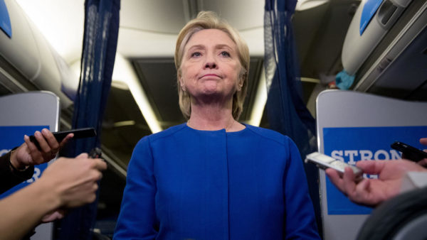 Democratic presidential candidate Hillary Clinton pauses while she gives remarks on the explosion in Manhattan's Chelsea neighborhood onboard her campaign plane at Westchester County Airport, in White Plains, N.Y., Saturday, Sept. 17, 2016. (Andrew Harnik / AP)