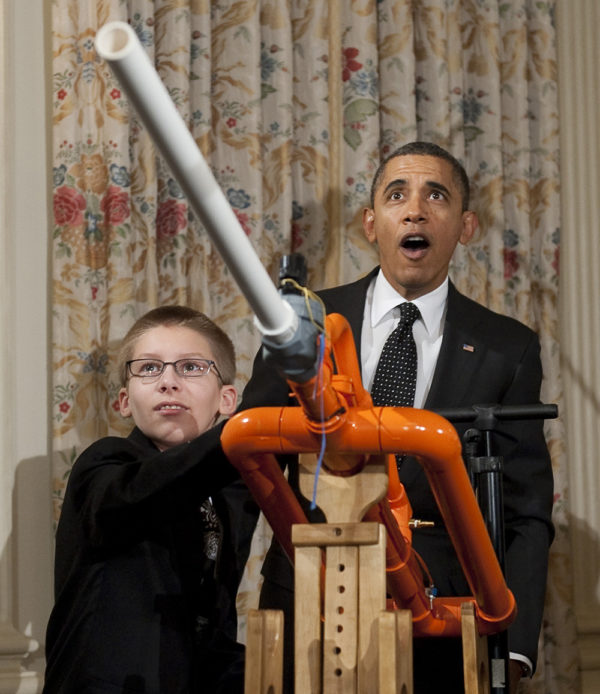US President Barack Obama reacts as 14-year-old Joey Hudy of Phoenix, Arizona, launches a marshmallow from Hudy's 'Extreme Marshmallow Cannon' during a tour of the White House Science Fair in the State Dining Room of the White House in Washington, DC, February 7, 2012. Photo: Saul Loeb / AFP - Getty Images.