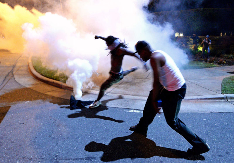 Protesters demonstrate in Charlotte, N.C., Tuesday, Sept. 20, 2016. Authorities used tear gas to disperse protesters in an overnight demonstration that broke out Tuesday after Keith Lamont Scott was fatally shot by an officer at an apartment complex. Jeff Siner/The Charlotte Observer via AP