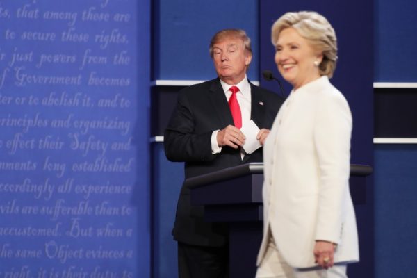 LAS VEGAS, NV - OCTOBER 19: Democratic presidential nominee former Secretary of State Hillary Clinton walks off stage as Republican presidential nominee Donald Trump looks on during the third U.S. presidential debate at the Thomas & Mack Center on October 19, 2016 in Las Vegas, Nevada. Tonight is the final debate ahead of Election Day on November 8. Chip Somodevilla/Getty Images/AFP