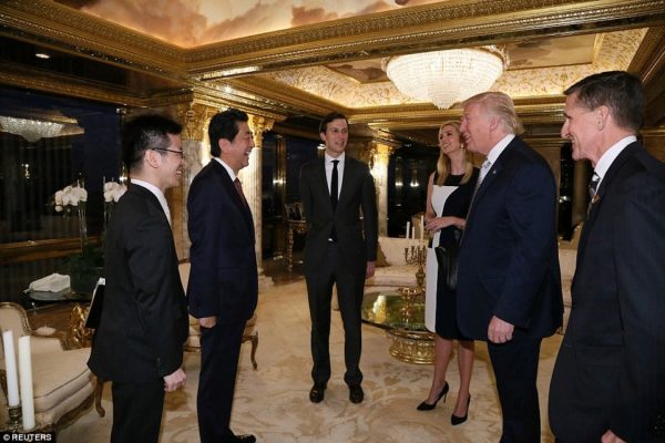 All smiles: Exactly what was discussed remains unknown - as do Kushner and Ivanka's roles in the meeting. Retired Lieutenant General Michael Flynn (far right) was also present. He has been offered a position as National Security Adviser by Trump. Handout via Reuters.