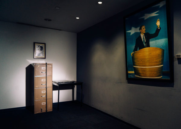 A filing cabinet broken into in 1972 as part of the Watergate burglary sits beside a computer server that Russian hackers breached during the 2016 presidential campaign at the Democratic National Committee’s headquarters in Washington. CreditJustin T. Gellerson for The New York Times