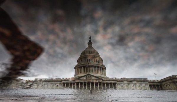 The antagonistic tone of the president-elect and his team, Trump's divisive cabinet choices, the pushback and what it portends for the future is embodied in this ominous image of the Capitol by Olivier Contreras.