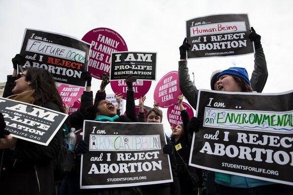 Zach Gibson/AFP caption: Pro-life supporters protest outside the US Supreme Court during the 44th annual March for Life on January 27, 2017 in Washington, DC. Anti-abortion activists are gathering for the 44th annual March for Life in Washington, protesting the 1973 Supreme Court decision legalizing abortion. 