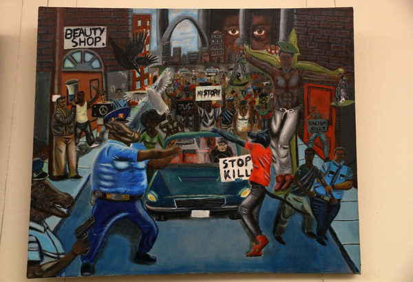 A painting is seen on the U.S. Capitol walls after it was rehung by members of the Congressional Black Caucus after it was removed by Rep. Duncan Hunter (R-CA) on Friday because he found it offensive on January 10, 2017 in Washington, DC. The painting is part of a larger art show hanging in the Capitol and is by a recent high school graduate, David Pulphus, and depicts his interpretation of civil unrest in and around the 2014 events in Ferguson, Missouri. (Jan. 9, 2017 - Source: Joe Raedle/Getty Images North America)