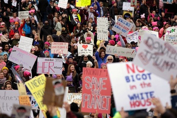 Joshua Lott/AFP caption: Demonstrators protest during the Women's March on January 21, 2017 in Washington, DC. Hundreds of thousands of people flooded US cities Saturday in a day of women's rights protests to mark President Donald Trump's first full day in office.