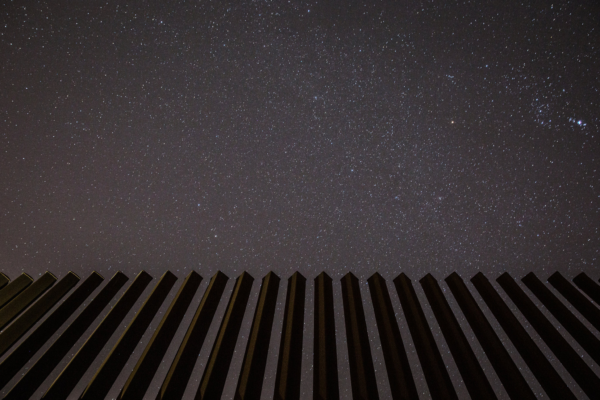Tamir Kalifa for The New York Times, “A starry sky on a clear night in January near Harlingen, Tex., where a border wall already exists.”