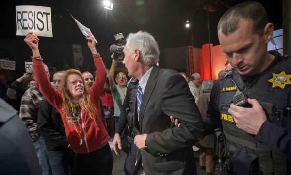 Roseville police escorted Republican congressman Tom McClintock through an audience on 4 February. Photograph: Randall Benton/AP