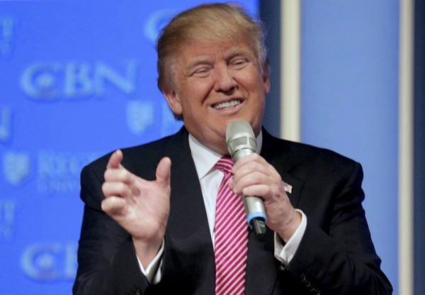 Donald Trump makes hand gesture during 2016 Republican primaries. Joshua Roberts/Reuters.