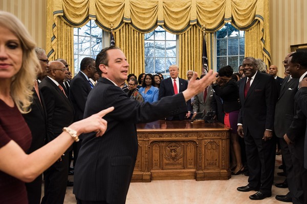 Counselor to the President Kellyanne Conway (L) and White House Chief of Staff Reince Priebus ((2nd-L) direct leaders of historically black universities and colleges for a photo with US President Donald Trump in the Oval Office of the White House before a meeting with US Vice President Mike Pence February 27, 2017 in Washington, DC. / AFP / Brendan Smialowski