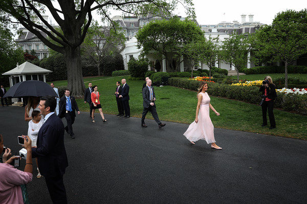 U.S. first lady Melania Trump walks to the White House residence after a reading session for children where she read from the book ÒParty AnimalsÓ during the 139th Easter Egg Roll on the South Lawn of the White House April 17, 2017 in Washington, DC. The White House said 21,000 people were expected to attend the annual tradition of rolling colored eggs down the White House lawn that was started by President Rutherford B. Hayes in 1878. (April 16, 2017 - Source: Win McNamee/Getty Images