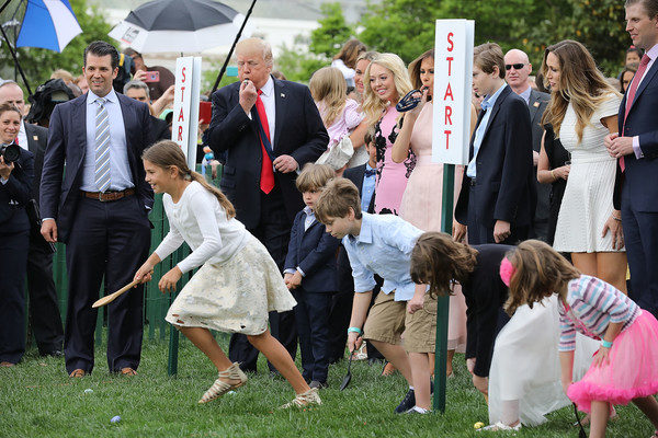 U.S. President Donald Trump (C) and his family, including (L-R) Donald Trump Jr., Tiffany Trump, first lady Melania Trump, Barron Trump, Lara Yunaska and Eric Trump kickoff a egg roll race during the 139th Easter Egg Roll with Trump's daughter Tiffany Trump on the South Lawn of the White House April 17, 2017 in Washington, DC. The White House said 21,000 people are expected to attend the annual tradition of rolling colored eggs down the White House lawn that was started by President Rutherford B. Hayes in 1878. (April 16, 2017 - Source: Chip Somodevilla/Getty Images