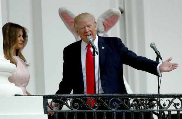 U.S. President Donald Trump and U.S. first lady Melania Trump welome guests to the White House during the 139th Easter Egg Roll on the South Lawn of the White House April 17, 2017 in Washington, DC. The White House said 21,000 people were expected to attend the annual tradition of rolling colored eggs down the White House lawn that was started by President Rutherford B. Hayes in 1878. (April 16, 2017 - Source: Win McNamee/Getty Images