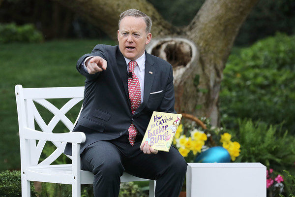 White House Press Secretary Sean Spicer reads the childrens' book 'How To Catch The Easter Bunny' during the 139th Easter Egg Roll on the South Lawn of the White House April 17, 2017 in Washington, DC. The White House said 21,000 people are expected to attend the annual tradition of rolling colored eggs down the White House lawn that was started by President Rutherford B. Hayes in 1878. (April 16, 2017 - Source: Chip Somodevilla/Getty Images