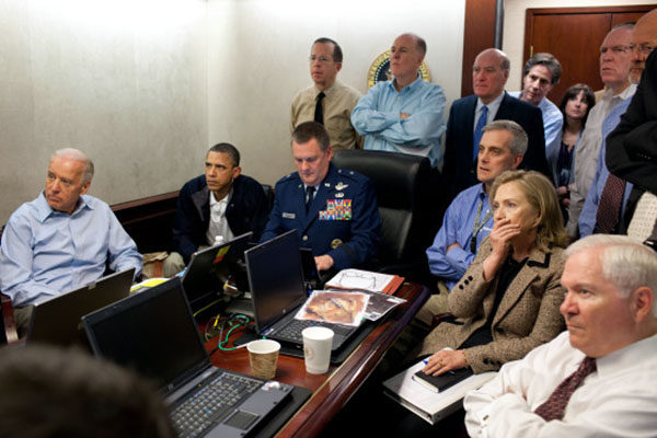 President Barack Obama and Vice President Joe Biden, along with with members of the national security team, receive an update on the mission against Osama bin Laden in the Situation Room of the White House, May 1, 2011. Please note: a classified document seen in this photograph has been obscured. (Official White House Photo by Pete Souza) This official White House photograph is being made available only for publication by news organizations and/or for personal use printing by the subject(s) of the photograph. The photograph may not be manipulated in any way and may not be used in commercial or political materials, advertisements, emails, products, promotions that in any way suggests approval or endorsement of the President, the First Family, or the White House.