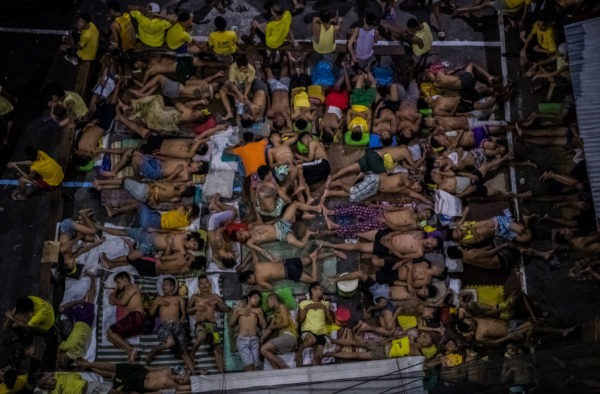 Government forces have gone door to door to more than 3.57 million residences, according to the police. More than 727,600 drug users and 56,500 pushers have surrendered so far, the police say, overcrowding prisons. At the Quezon City Jail, shown in the middle photo below, inmates take turns sleeping in any available space, including a basketball court. Daniel Berehulak for The New York Times.